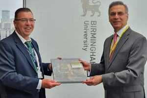Pakistan High Commissioner to the UK, Moazzam Ahmad Khan, after his meeting with Deputy Vice-Chancellor of Birmingham City University, Professor Julian Beer on academic collaboration between Pakistani and UK universities, presenting him a coffee tabl